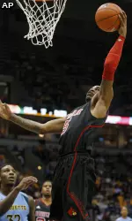 Chris Smith drives in the regular-season meeting.