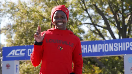Louisville runner Dorcas Wasike celebrates after winning the 2018 ACC Cross Country Championship in Boston, Mass., Friday, Oct. 26, 2018. (Photo by Mary Schwalm, theACC.com)