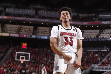 Jordan Nwora celebrates after scoring a dunk against Southern