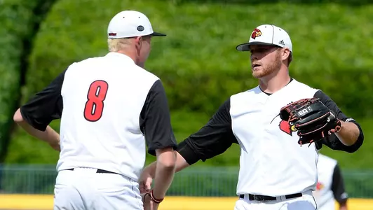 Louisville pitcher Austin Conway (29) congratulates Louisville pitcher Nick Bennett (8) on their win during game thirteen of the 2018 ACC Baseball Tournament in Durham, N.C., Saturday, May 26, 2018. (Photo by Sara D. Davis, theACC.com)