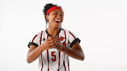 Ravin Alexander laughing during her studio photo shoot.