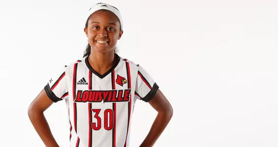 Women's soccer sophomore Amari Hopkins smiles for the camera at photo day