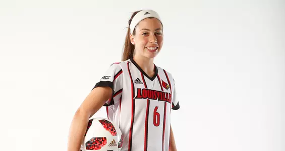 Arianna Ferraro smiles for the camera during the team photo shoot.
