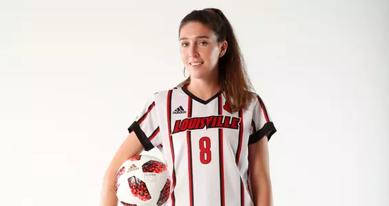 Niamh Nelson smiles for the camera at the team's photo shoot