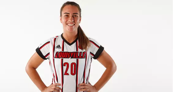 Freshman Emily Knepler smiles for the camera during a team photo shoot