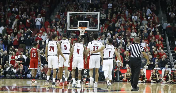 Five Louisville starters walk to the court to begin the second half