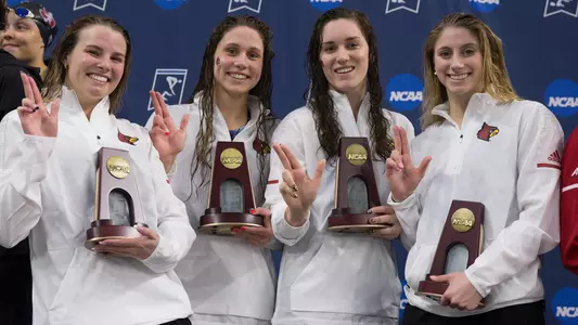 The Cardinals accept their award on the podium at the NCAA Championships in the 200 free relay.