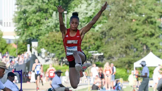 Alexis Gibbons competes in the long jump