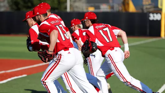 The Cardinals take the field before their game against Kentucky at Jim Patterson Stadium on April 2.