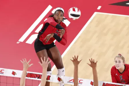  Aiko Jones takes a swing from the right side.  Default Caption (Optional)	