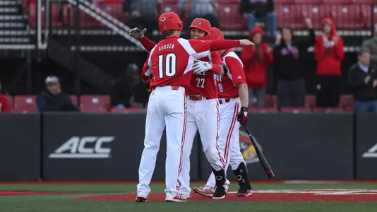 Ben Metzinger and Tim Borden hugging after a home run against Morehead State.