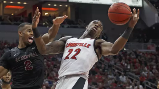 Aidan Igiehon fights for a loose ball in the KFC Yum! Center.
