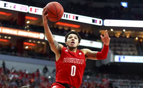 Lamarr "Fresh" Kimble drives to the hoop on Senior Day vs. Virginia Tech.