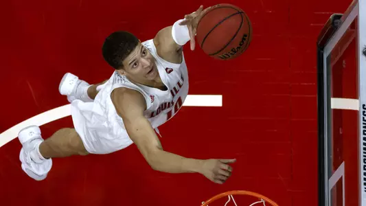 Samuell Williamson attacks the rim in this photo shot above the goal in the KFC Yum! Center.