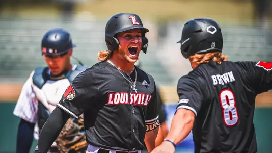 Lucas Dunn and Luke Brown after a home run at the ACC Championship in Charlotte.