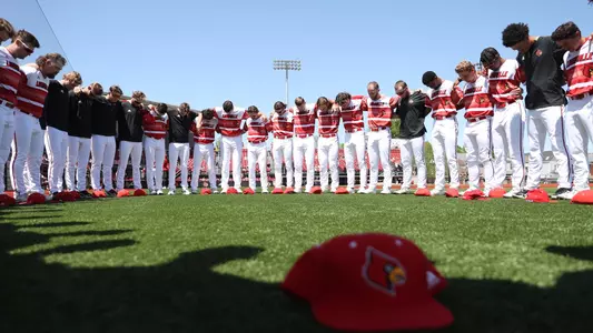 The Cardinals huddle before the game against Clemson.