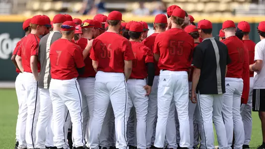 The Cardinals huddle at Vanderbilt.