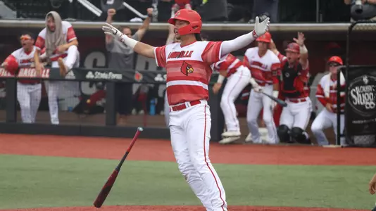Cameron Masterman hits a home run against Michigan.