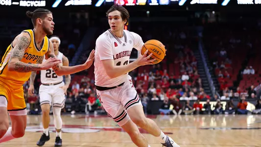 Danilo Jovanovich drives to the basket against Coppin State at the KFC Yum! Center on Nov. 15, 2023.