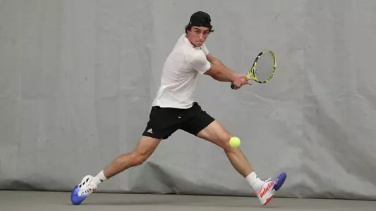 Will Mayew returns the ball against Boston College