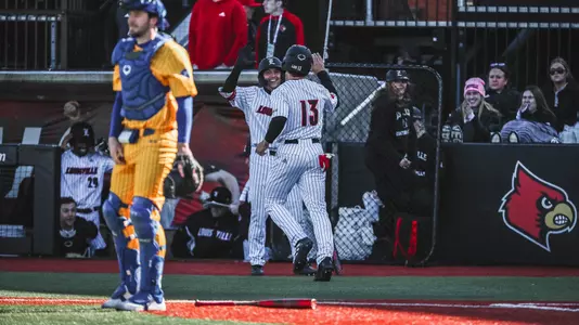 Christian Knapczyk and JT Benson high five against Morehead State.