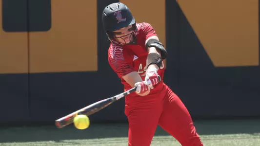 Korbe Otis hits the ball in the Knoxville Regional game against Indiana