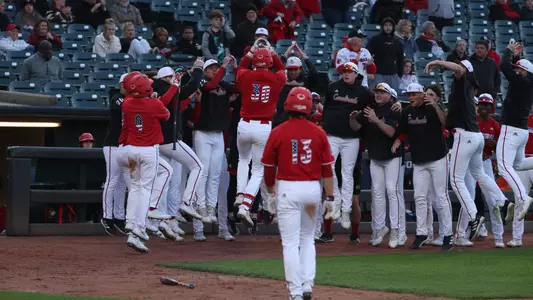 The Cardinals celebrate a Ryan McCoy home run against Bellarmine.
