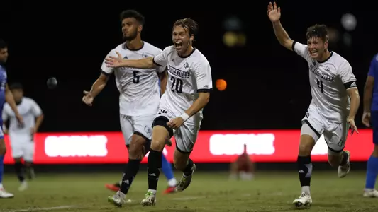 The Cardinals celebrate a goal by Parker Forbes against Kentucky.