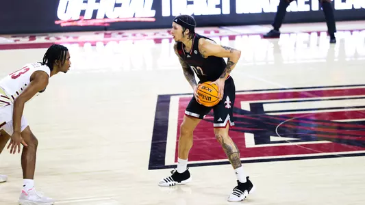 Tre White looks to pass the ball at Boston College on Feb. 13, 2024.