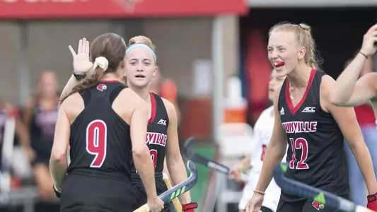 Field hockey celebrates a goal against Virginia