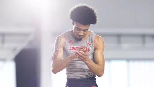 Brion Stephens celebrates after clearing the bar in the high jump at the PNC Lenny Lyles Invitational.
