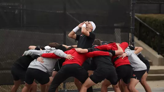 Etienne Donnet and the Louisville men's tennis squad huddles up before match on February 9, 2024 at the Bass-Rudd Tennis Center