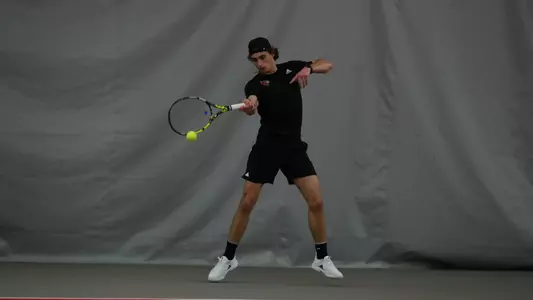 Will Mayew hits forehand at the Bass-Rudd Tennis Center against Florida State on March 1, 2024