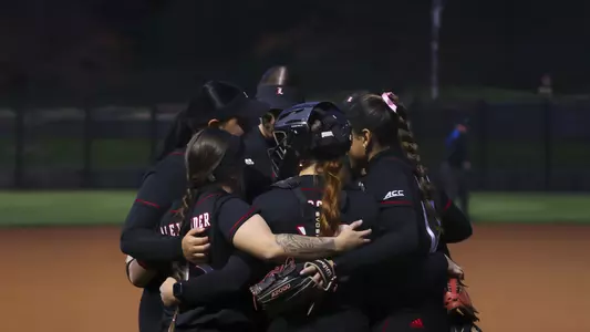 Louisville softball huddle vs. Duke