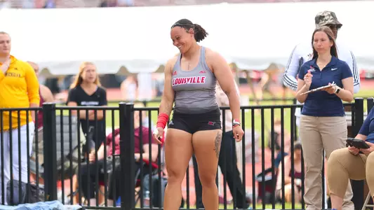 Jayden Ulrich smiles after breaking the school record in the women's shot put at the Clark Wood Invitational.