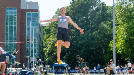 Jake Burkey competes in the long jump at the ACC Outdoor Championships