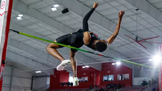 Josh Moore clears the bar in the men's high jump at the Louisville Opener
