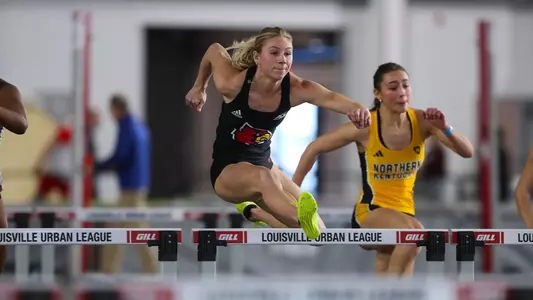 Maya Follmer leaps over a hurdle at the 2025 Bellarmine Open