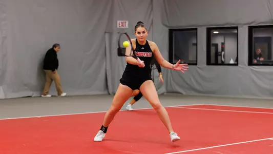 Lika Peresypkina turns to hit a ball