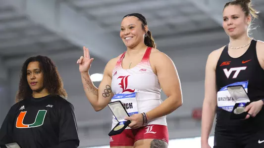 Jayden Ulrich poses with her gold medal after winning the women's shot put at the 2025 ACC Indoor Championships.