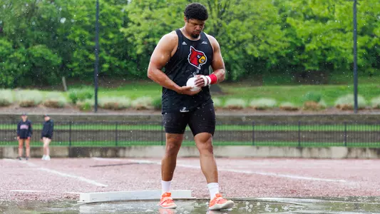 Noah Koch steps into the shot put ring in the rain at the 2025 Jim Freeman/Clark Wood Invitational.