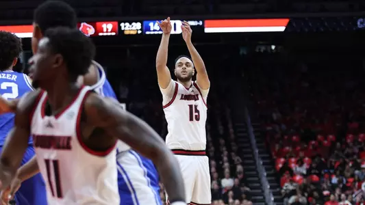 Aly Khalifa shoots over a Duke defender