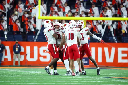 Cards' Defense Celebrates Against Syracuse