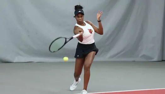 Rebekkah Gaines returns a volley 
