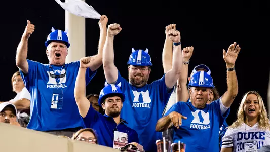 Duke football fans celebrate after a Blue Devils touchdown against Virginia Tech.