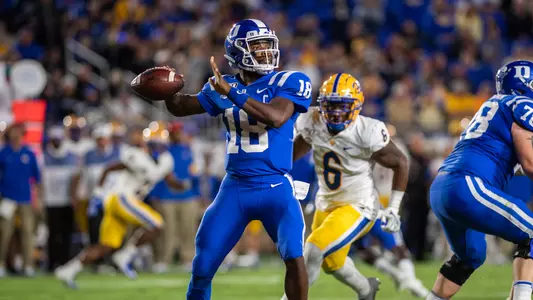 Quarterback Quentin Harris throwing a pass.