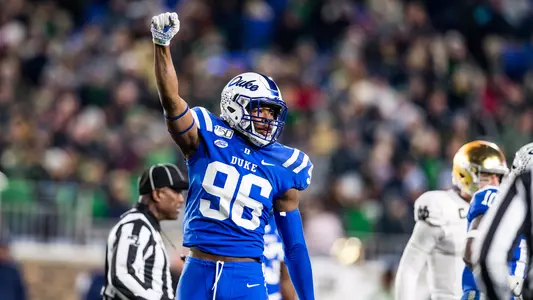 Chris Rump II signals fourth down after a stop on third