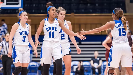 Azana Baines giving teammate Kyra Lambert a high five