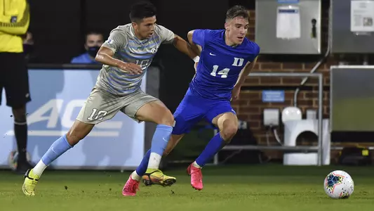 Peter Stroud goes up against a North Carolina player. 