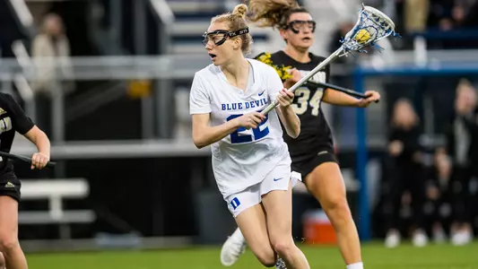 Veronica Hineman carries the ball up the field